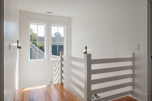 409 W Indian Ave, Folly Beach, SC 29439 - interior space featuring wood finished floors, baseboards, and visible vents