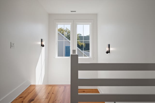 409 W Indian Ave, Folly Beach, SC 29439 - doorway featuring wood finished floors, baseboards, and visible vents