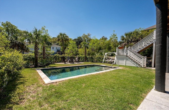 409 W Indian Ave, Folly Beach, SC 29439 - outdoor pool featuring a yard, a patio, and stairs