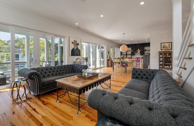 409 W Indian Ave, Folly Beach, SC 29439 - living room featuring light wood-style flooring, french doors, and recessed lighting