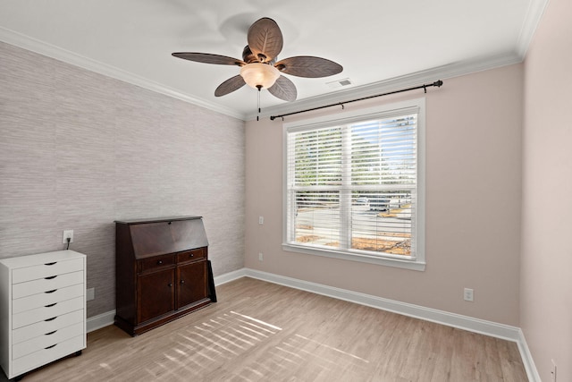 unfurnished bedroom featuring crown molding, ceiling fan, and light wood-type flooring