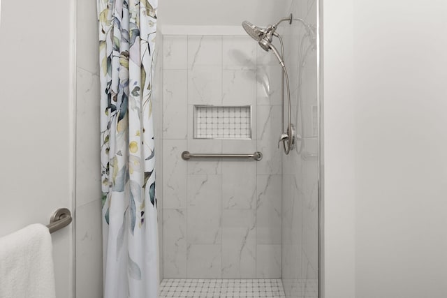 bathroom with a shower with shower curtain