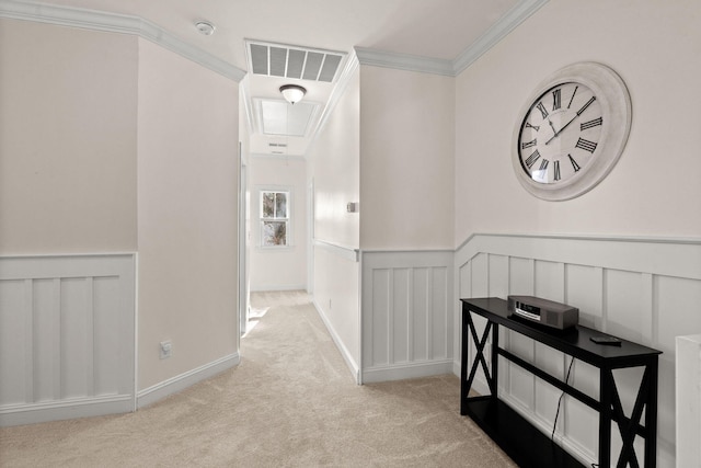 hallway featuring light colored carpet and ornamental molding