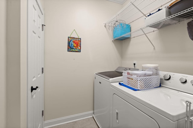 clothes washing area with independent washer and dryer