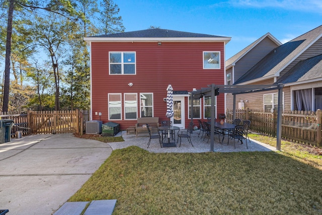 back of house with a yard, a patio area, and a pergola