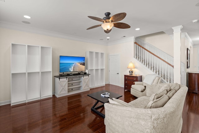 living room featuring crown molding, decorative columns, dark hardwood / wood-style floors, and ceiling fan