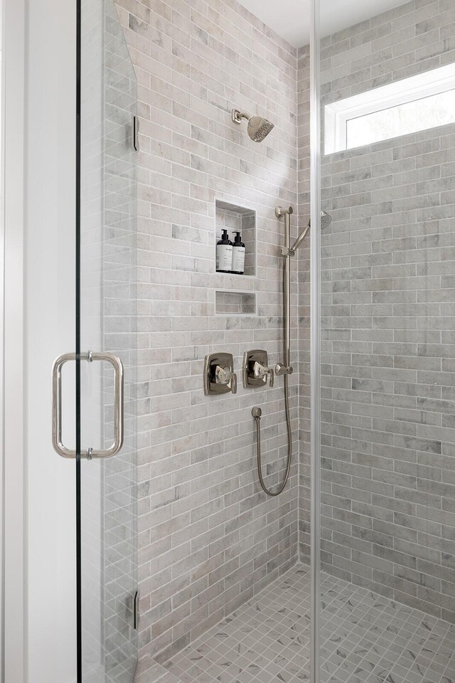 bathroom featuring a shower stall