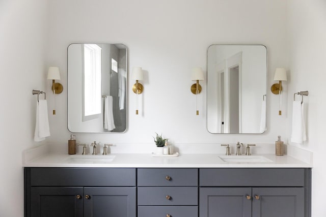 full bathroom featuring double vanity and a sink