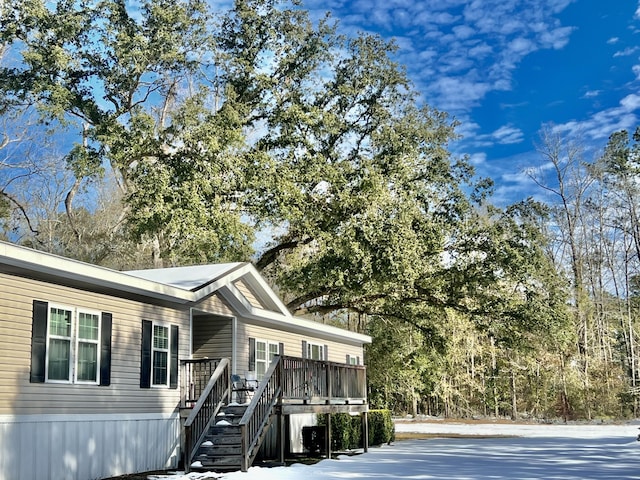 view of front of property with a wooden deck