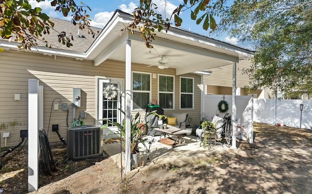 back of house featuring cooling unit, a patio area, and ceiling fan