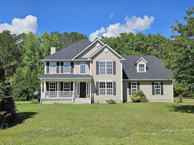 3564 Elliott Rd, Pinewood, SC 29125 - colonial house with a porch, a chimney, a front lawn, and a shingled roof