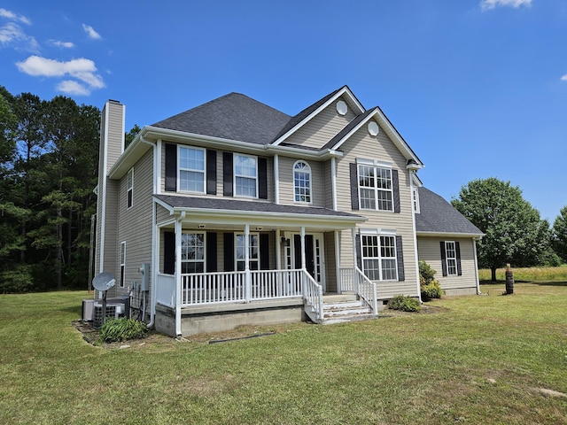 3564 Elliott Rd, Pinewood, SC 29125 - view of front of property featuring a porch, a chimney, a front yard, and central AC