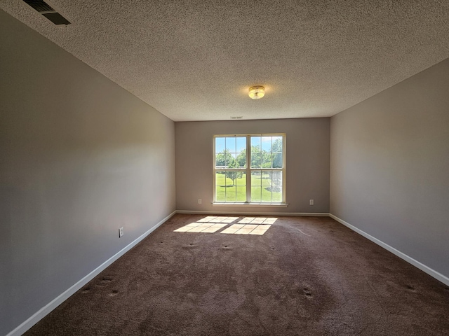3564 Elliott Rd, Pinewood, SC 29125 - carpeted empty room featuring baseboards and a textured ceiling