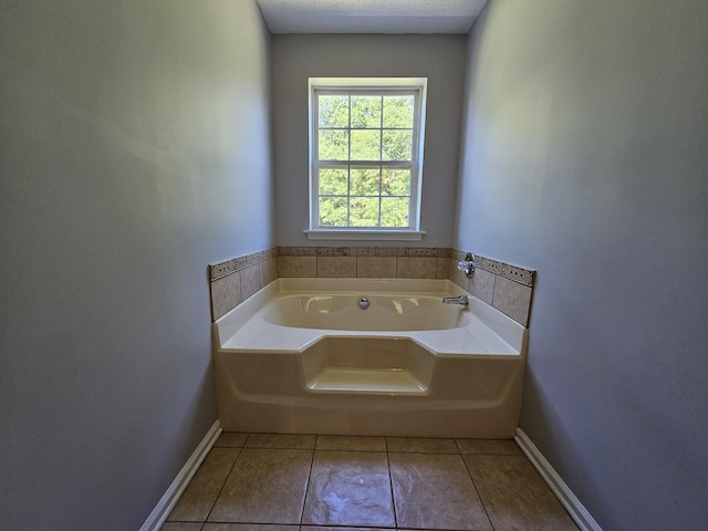 3564 Elliott Rd, Pinewood, SC 29125 - full bathroom featuring tile patterned flooring, a bath, and baseboards