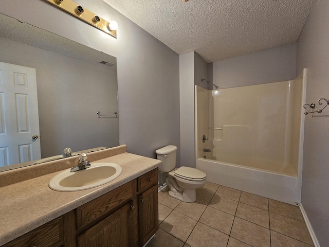 3564 Elliott Rd, Pinewood, SC 29125 - bathroom with a textured ceiling, toilet, tile patterned flooring, vanity, and bathing tub / shower combination