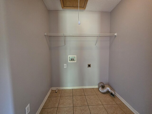 3564 Elliott Rd, Pinewood, SC 29125 - clothes washing area with electric dryer hookup, washer hookup, tile patterned floors, baseboards, and cabinet space