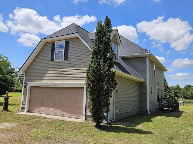 3564 Elliott Rd, Pinewood, SC 29125 - view of home's exterior featuring a garage, a lawn, a shingled roof, and driveway