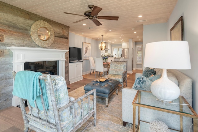 living room with wooden ceiling, light wood-type flooring, and ceiling fan