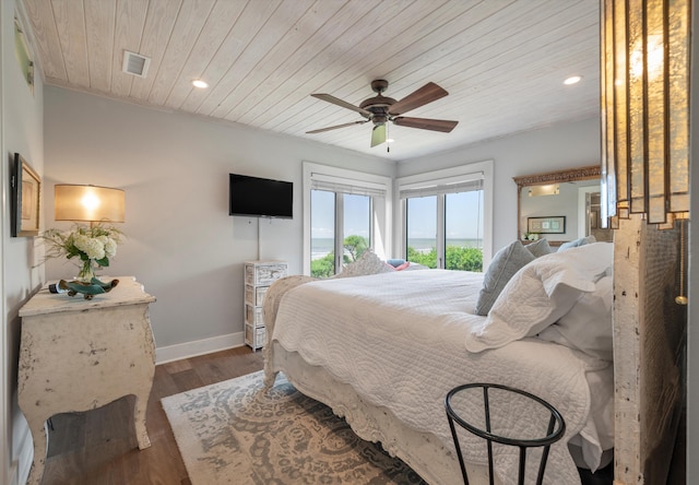 bedroom with wooden ceiling, hardwood / wood-style floors, and ceiling fan