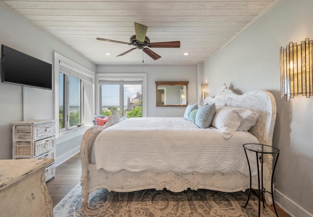 bedroom with wooden ceiling, hardwood / wood-style flooring, crown molding, and ceiling fan