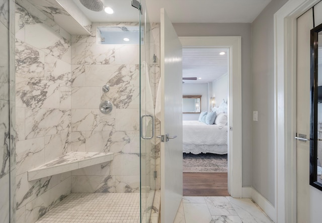 bathroom featuring an enclosed shower and hardwood / wood-style flooring