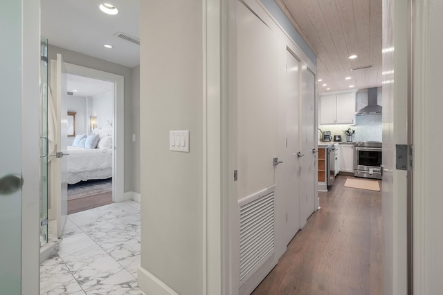 hallway featuring light tile flooring