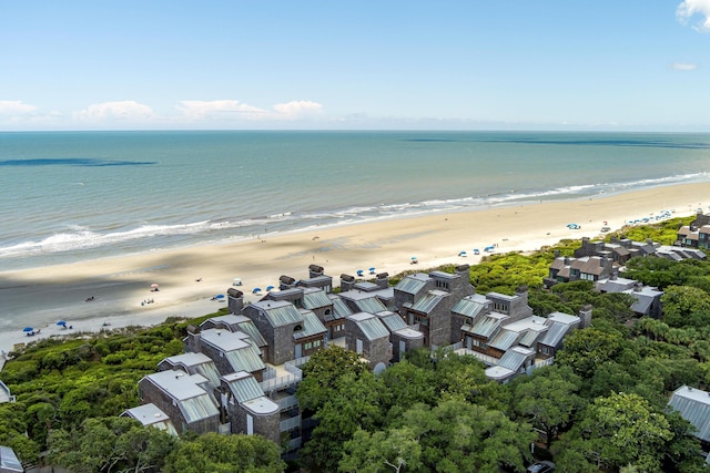 birds eye view of property with a beach view and a water view