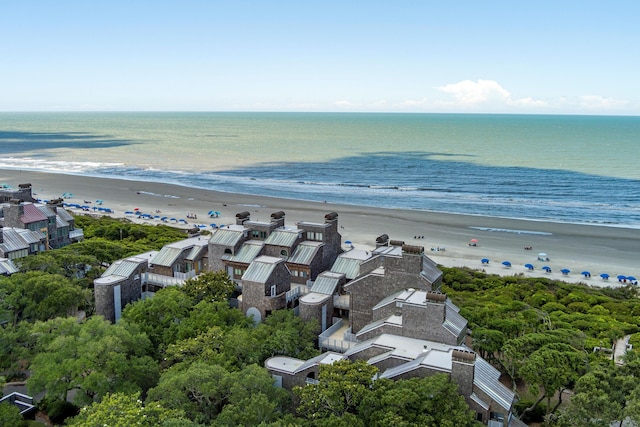 birds eye view of property with a view of the beach and a water view