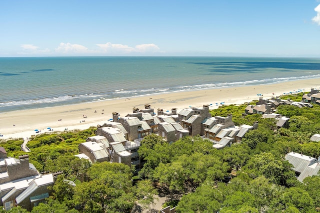 birds eye view of property featuring a view of the beach and a water view