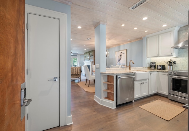 kitchen featuring white cabinetry, dark hardwood / wood-style flooring, stainless steel dishwasher, and stove