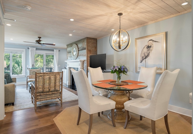 dining space featuring crown molding, hardwood / wood-style flooring, wood ceiling, and ceiling fan with notable chandelier