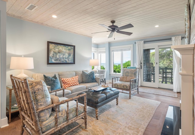 living room featuring ceiling fan, wood ceiling, and wood-type flooring