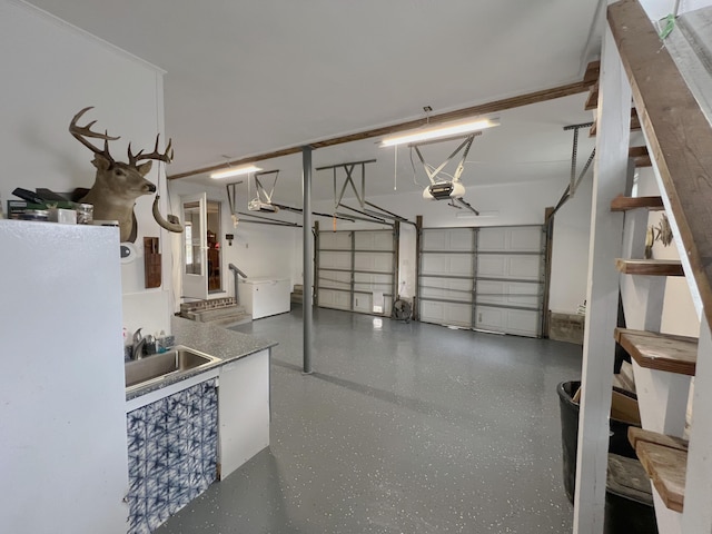 garage featuring a sink and a garage door opener