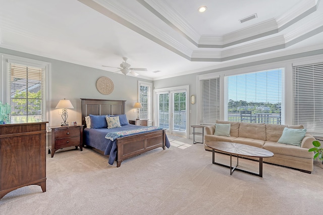 bedroom featuring multiple windows, visible vents, light colored carpet, and access to exterior