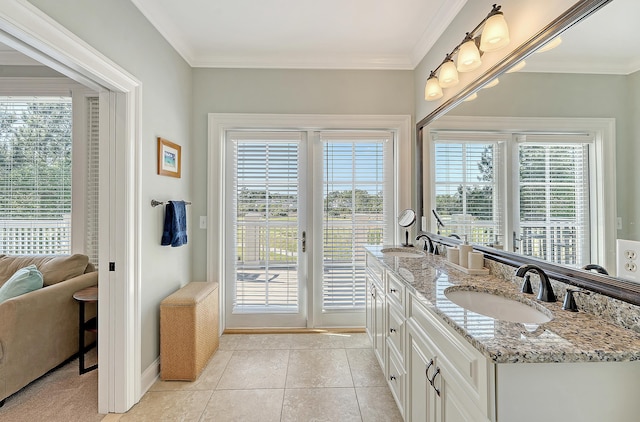 full bath featuring ornamental molding, tile patterned floors, and a sink
