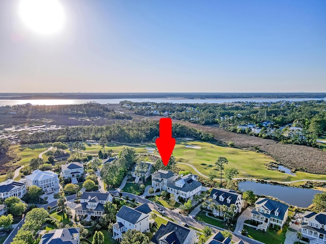 drone / aerial view featuring a residential view, a water view, and golf course view