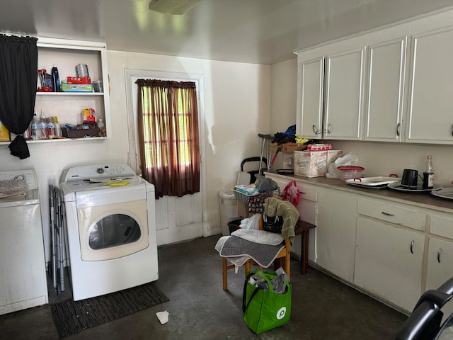 clothes washing area with washer and dryer