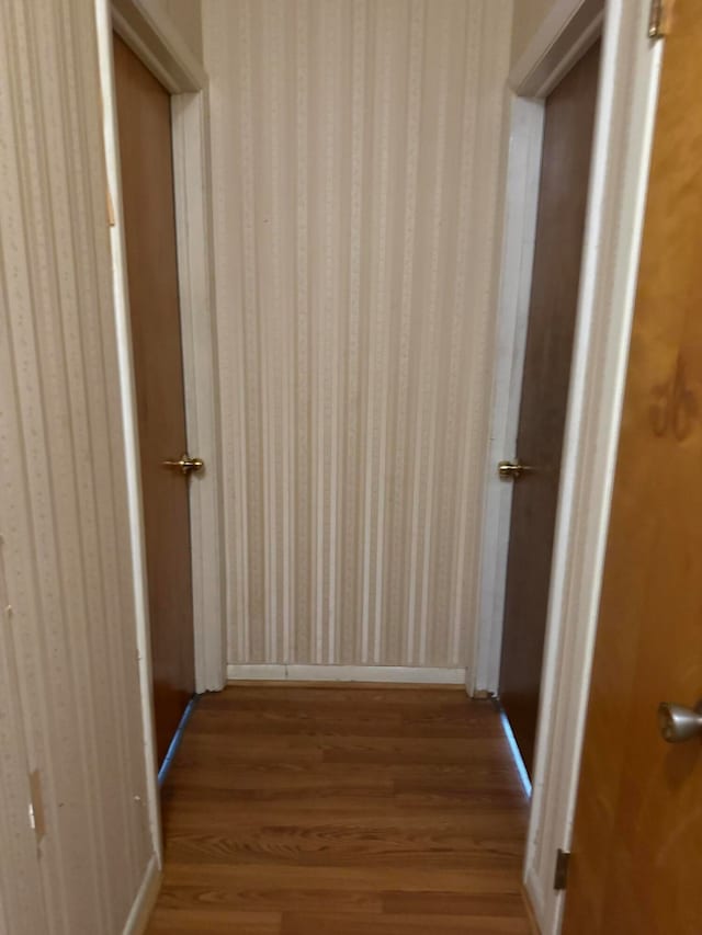 hallway with light hardwood / wood-style floors