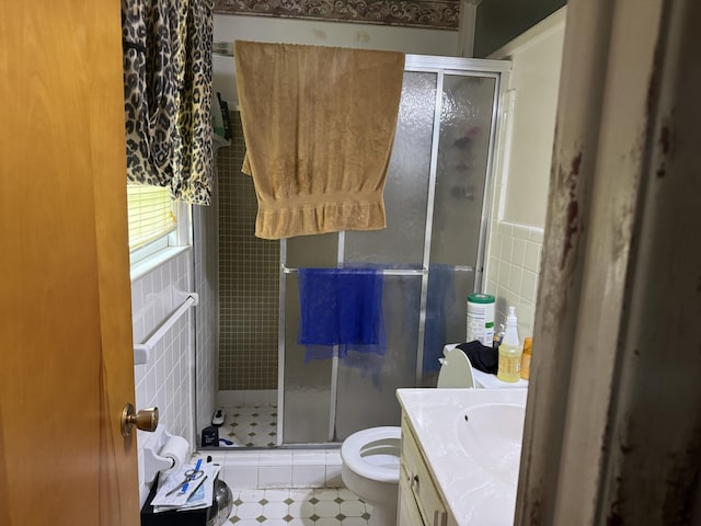 8520 Delhi Rd, North Charleston, SC 29406 - bathroom with vanity, a shower stall, toilet, and tile walls