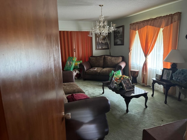 living room with light carpet, a textured ceiling, and a chandelier