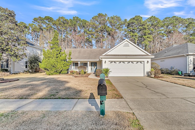 view of front of home featuring roof with shingles, driveway, and an attached garage