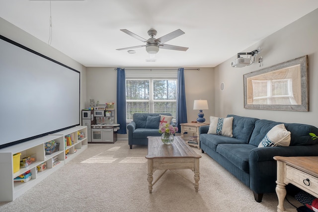 interior space with ceiling fan and light colored carpet