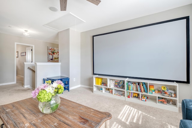 cinema with carpet and baseboards