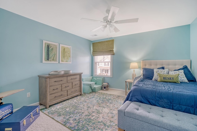 bedroom with carpet floors, visible vents, ceiling fan, and baseboards