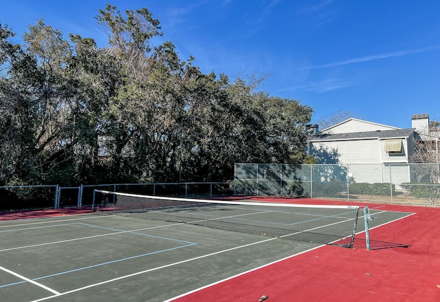 view of sport court with fence