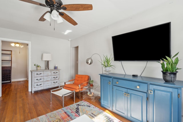 interior space with ceiling fan and dark hardwood / wood-style floors