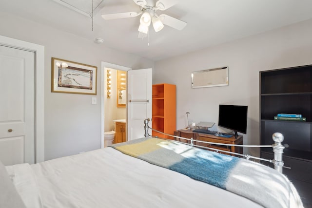 bedroom featuring ceiling fan, a closet, and ensuite bathroom