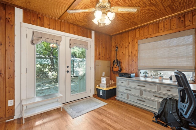 home office with french doors, wood walls, and wood ceiling