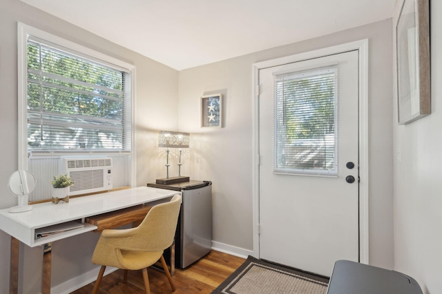 office space featuring wood-type flooring and cooling unit