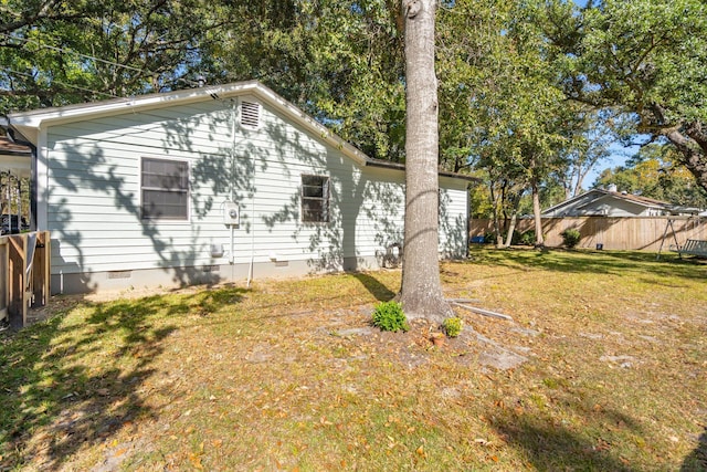 view of home's exterior with a yard